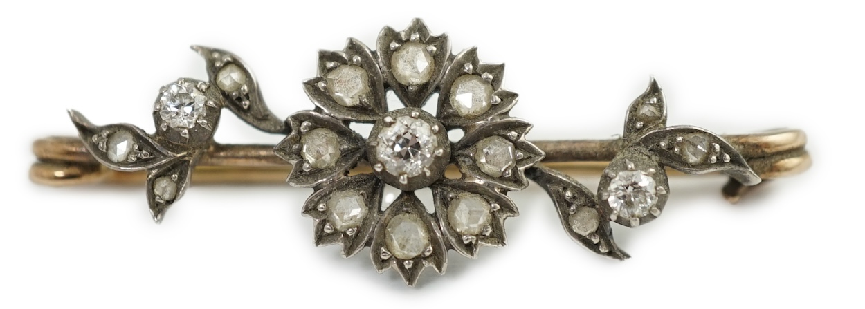 A Victorian gold, silver and diamond flower bar brooch